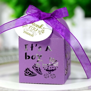 Laser cut purple paper favor box with It's A Boy pattern and silk ribbon for baby shower