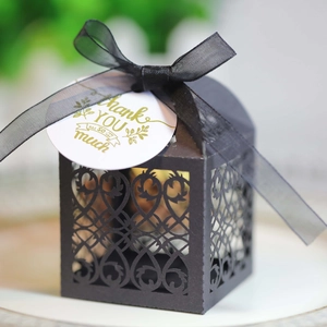 Elegant black laser-cut candy gift box with black ribbon and Thank You gold tag