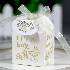 White Baby Boy laser cut favor box with It's A Boy cutout and ribbon decoration