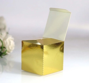 Detailed macro view of a square gold mirror-finish folding gift box for party candies
