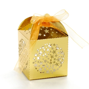 Golden hollow star candy gift box with elegant satin ribbon bow for festive celebrations