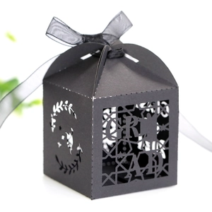 Close-up of black hollow GRAD paper candy box with star cutout and black ribbon bow