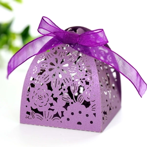 Elegant purple laser-cut wedding favor box with pearl texture, floral bunny motifs and ribbon