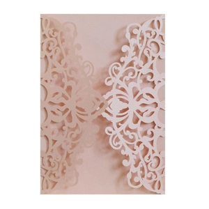 Laser cut hollow wedding invitation cover in rose gold pearlescent paper with floral pattern