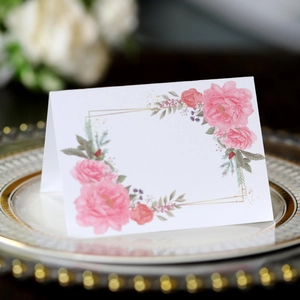 Elegant floral place card with pink roses and gold geometric frame for wedding table decor
