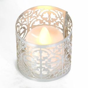 Intricate laser-cut metal lantern with LED flickering candle for home decor and events