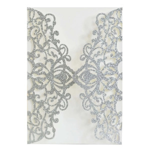 Elegant laser-cut silver glitter wedding invitations with intricate floral hollow patterns