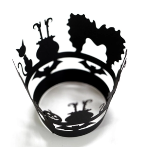 Laser cut black Halloween cupcake wrappers featuring bats, pumpkins, and witch silhouettes