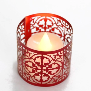 Red laser-cut metal candle holder with hollow European pattern and warm LED light