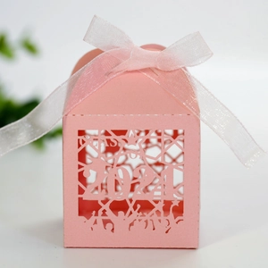 Detailed laser-cut pink graduation candy box featuring Class of 2021 with white ribbon bow