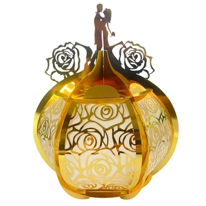 Golden laser-cut wedding candy box with hollow rose patterns and kissing couple silhouette