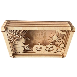 3D Halloween shadow box with laser-cut wood witch, pumpkin, and spider web design