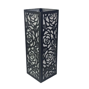 Black laser-cut metal lantern with rose flower patterns for Valentine's Day decor