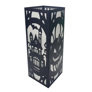 Laser-cut black Halloween paper lantern featuring pumpkin and castle silhouette
