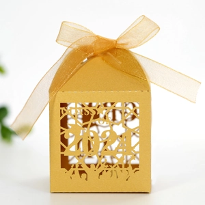 Detail of golden hollow graduation candy box with Class of 2021 cutout and gold ribbon