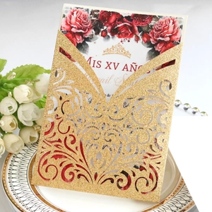 Laser cut gold glitter Quinceañera invitation featuring red roses and crown design
