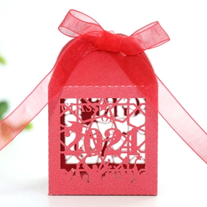 Detail of red laser-cut Class of 2024 graduation candy gift box with a red silk bow