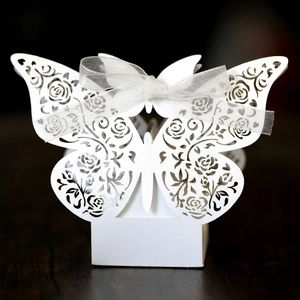 Elegant white laser-cut butterfly wedding candy box with rose pattern and silk ribbon