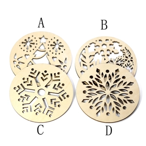 Detailed laser-cut wooden Christmas coasters with snowflake and reindeer patterns
