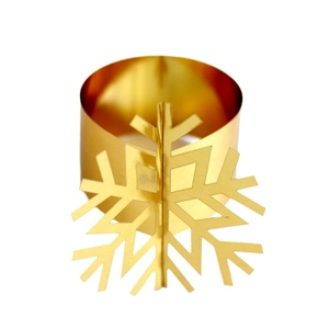 Golden laser-cut snowflake metal napkin ring with shiny mirror finish for Christmas decor