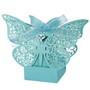 Light blue laser-cut butterfly wedding favor box with floral patterns and silk ribbon bow