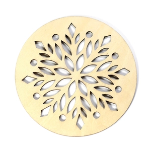 Laser-cut wooden Christmas snowflake coaster with intricate geometric cutout patterns