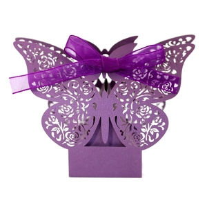 Elegant purple butterfly wedding favor box with laser-cut rose patterns and ribbon bow