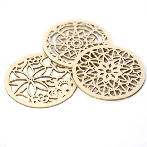 Laser-cut wooden flower coasters with geometric mandala patterns in natural wood finish