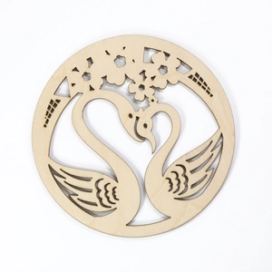 Laser-cut wooden coaster with butterfly and swan patterns for table decoration