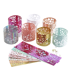 Laser cut floral paper napkin rings in seven colors for party tabletop decoration