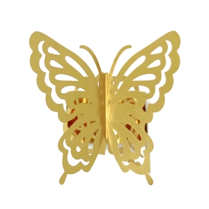 Close-up of golden dual-layer laser-cut butterfly napkin ring with hollow design