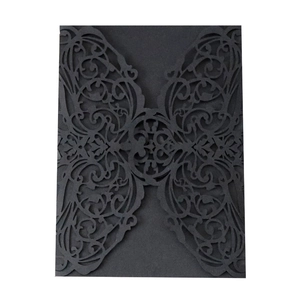 Elegant black laser-cut wedding invitation cover with intricate butterfly wing patterns