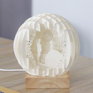 3D laser-cut wedding night light with castle paper carvings and wooden base