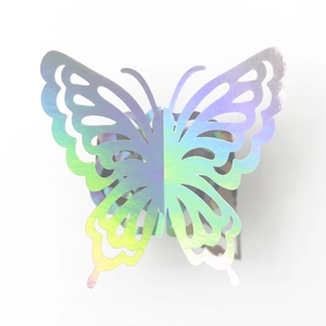 Detailed macro of hollow butterfly napkin ring with iridescent holographic finish