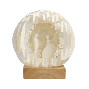 DIY foldable spherical paper carving lamp with romantic wedding scene and wood base