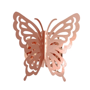 Detail of rose gold 3D laser-cut butterfly napkin ring with hollowed wing patterns