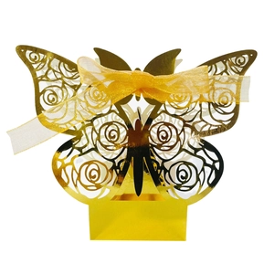 Golden laser-cut butterfly gift box with rose patterns and yellow organza ribbon