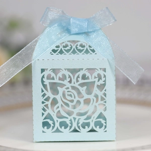Elegant light blue laser-cut wedding favor box with rose patterns and silk ribbon bow