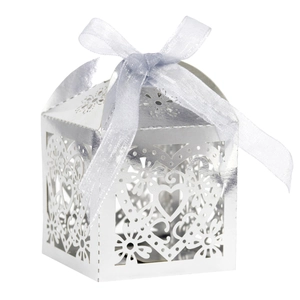 Elegant white laser-cut heart favor box with silver ribbon for weddings and parties