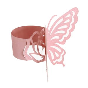 Detailed close-up of pink laser-cut napkin ring with hollow butterfly and floral design