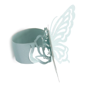 Detail of light blue butterfly napkin ring with intricate laser-cut hollow pattern