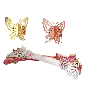 Laser-cut butterfly napkin rings in gold and rose gold metallic finishes for table decor