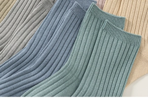 Detail of ribbed knit texture on kids' solid color mid-tube cotton sports socks