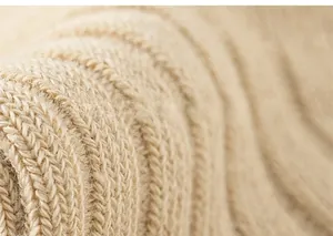 Detailed macro view of beige mesh knit texture on breathable cotton children's socks