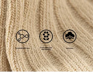 Detail of beige ribbed knit fabric showing soft texture and skin-friendly mesh material