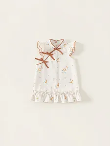 Abito qipao bianco per bambine con fiori, fiocchi arancioni e orlo a volant