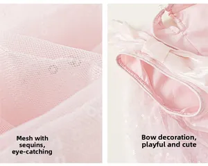 Dettaglio del vestito rosa da bambina con tulle di paillettes, fiocco e perle