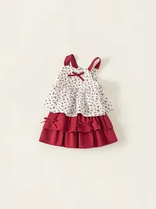 Girls floral strap top and red tiered skirt set with bow accents for summer wear