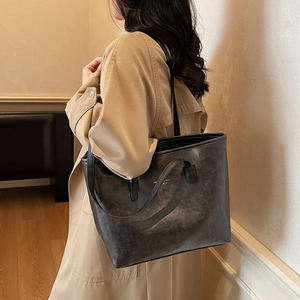 Vintage waxed leather tote bag in dark grey with gold lettering for daily commuting