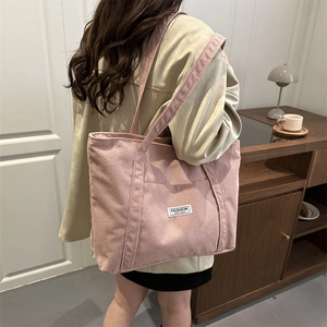 Pink corduroy tote bag for women featuring a minimalist design and large capacity